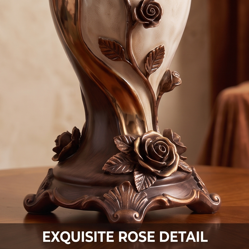 CASNELA exquisite rose detail — base close-up showing ornate scrollwork feet, full rose blooms and trailing vine stem in deep antique bronze