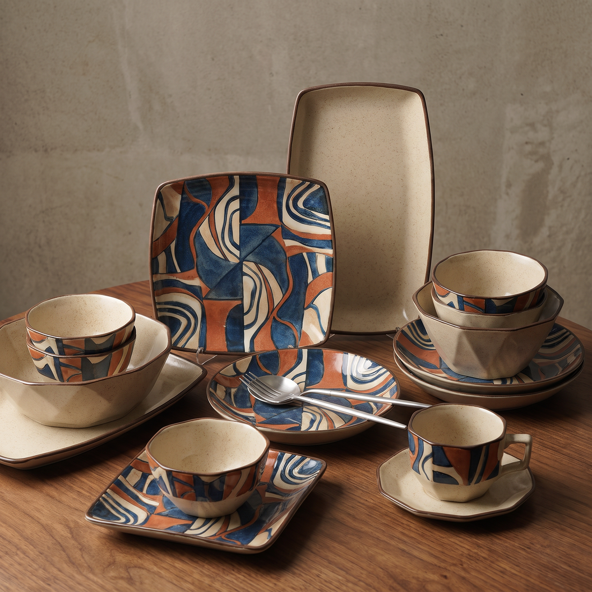 CASNELA abstract ceramic plates and bowls overhead showing versatile for every meal — colorful salad and pasta spread