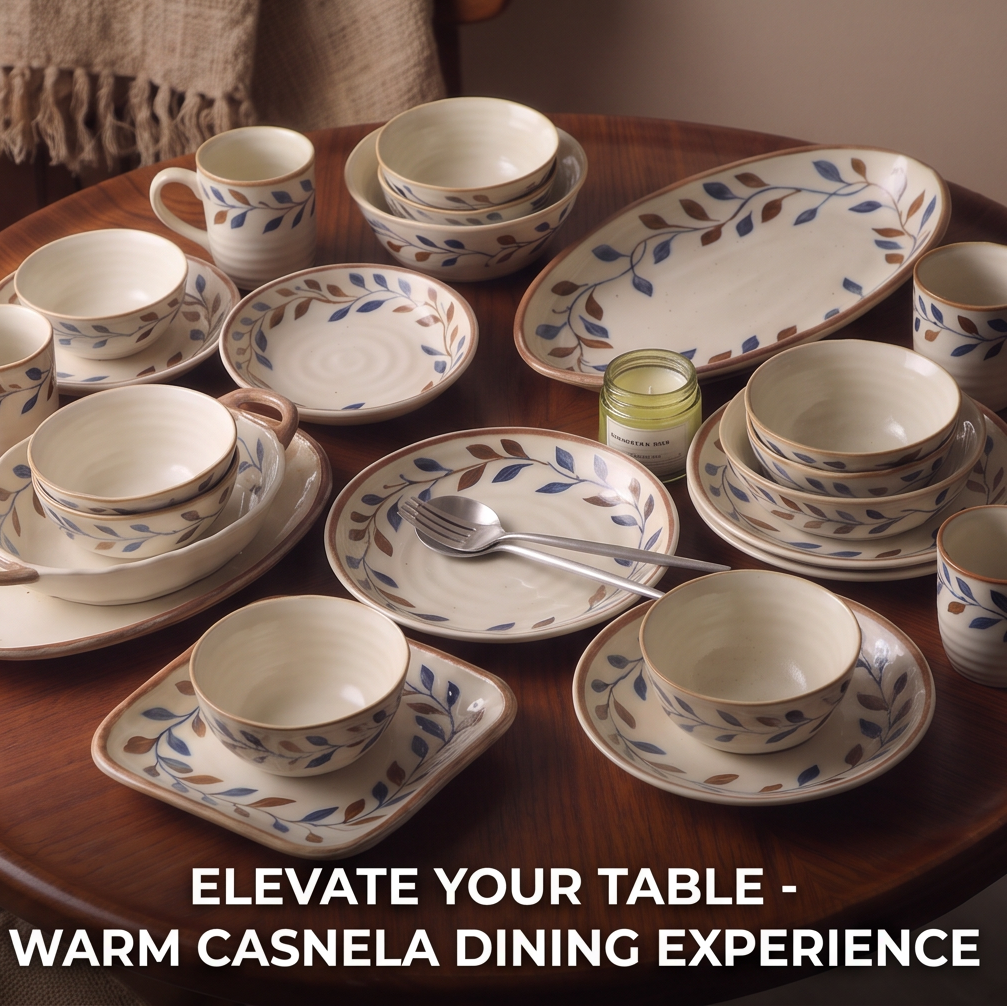 CASNELA versatile oven-to-table — oval double-handled baking dish on oval serving platter surrounded by bowls and cups