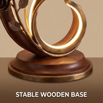 CASNELA stable wooden base — close-up of solid walnut round base with antique gold trim and LED curl