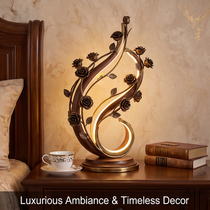 CASNELA rose vine LED lamp full profile on dark sideboard against gold-veined wall — elegant S-curve silhouette